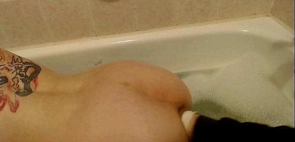  German slut takes a bath in her own piss, fucks huge dildos and gets a hard fistfuck